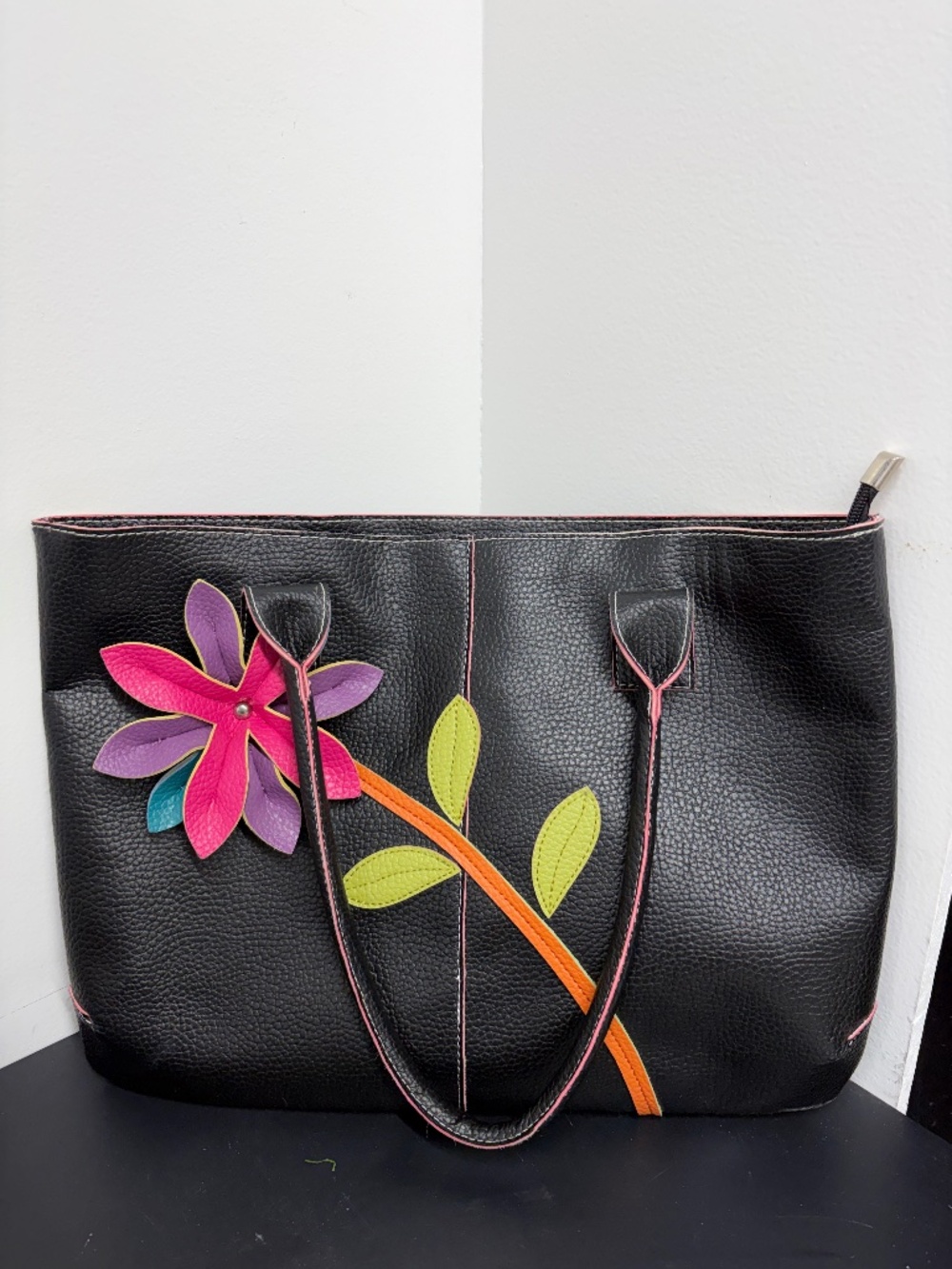 Mellow World Black Faux Leather Handbag Featuring A Colorful 3D Flower Accent